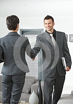 Business partners shaking hands