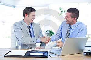 Business partners shaking hands