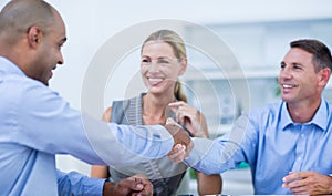 Business partners shaking hands