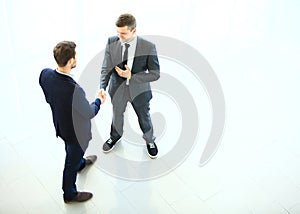 Business partners shaking hands as a symbol of unity