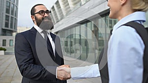 Business partners shaking hands, getting acquainted before cooperation, teamwork