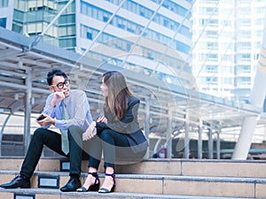 Business partners talking in an urban city setting.