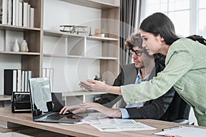 Business partners working at meeting in office, Man and woman working together in office