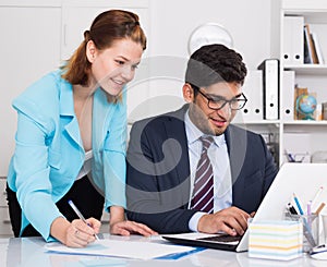 Business partners working in office