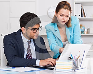 Business partners working in office