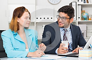 Business partners working in office