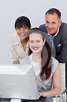 Business partners working together at a computer