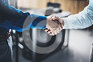 Business partnership handshake concept.Closeup photo of two businessmans handshaking process.Successful deal after great