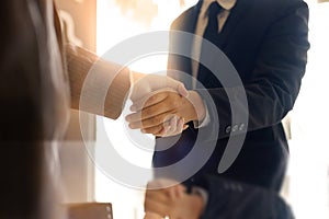 Business partnership handshake concept.Photo two coworkers hands photo