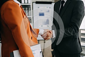 Business partnership handshake concept.Photo two coworkers handshaking process.Successful deal after great meeting