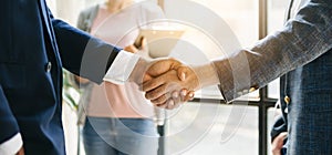 Business partnership handshake concept.Photo two coworkers handshaking process.Successful deal after great meeting. in office