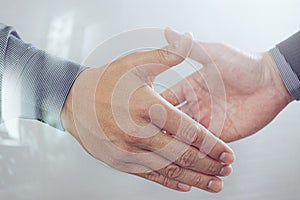 Business partnership meeting concept.photo businessmans handshake. Successful businessmen handshaking after perfect deal.close up