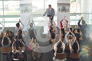 Business people applauding in a business seminar