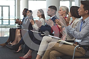 Business people applauding in a business seminar