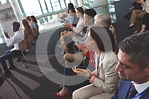 Business people applauding in a business seminar