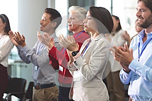 Business people applauding in a business seminar