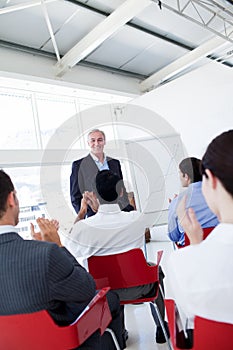 Business people applauding a conference