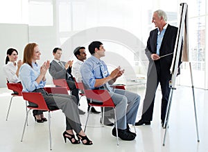 Business people applauding at a conference