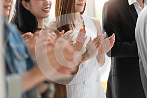 Business people applauding in a meeting