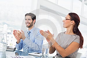 Business people applauding at meeting