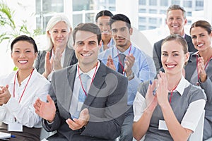 Business people applauding during meeting