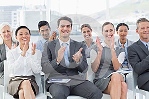 Business people applauding during meeting