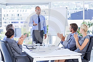 Business people applauding during meeting