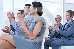 Business people applauding during meeting