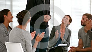 Business people applauding during meeting