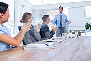 Business people applauding during a meeting