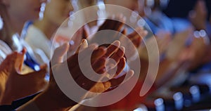 Business people applauding while sitting on seats in auditorium 4k