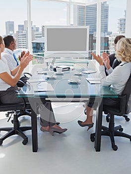 Business people applauding during a video conference