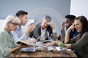 Business People Arguing In Meeting