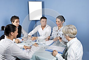 Business people around a table at meeting photo