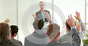 Business people asking question during meeting