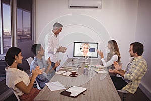 Business people attending video conference in office