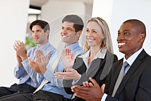 Business people, audience and clapping for success at seminar, event and conference for training. Employees, team and