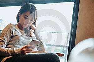 business people background young business woman using mobile phone and sitting in office. image for copy