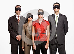 Business people in blindfolds