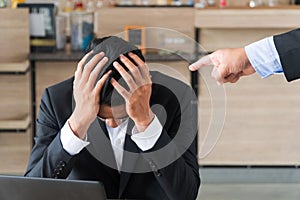 Business people the boss, point fingers, blame. businessmen holding the head stress being boss blame.  Concept of accused photo