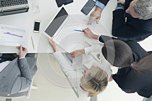 Business people brainstorming at office desk