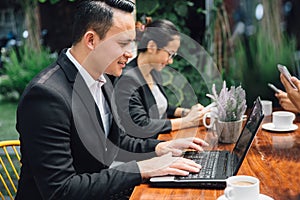 Business people busy working with team at a cafe