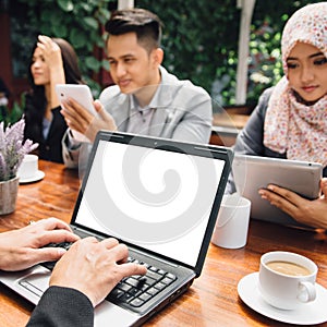 Business people busy working with team at a cafe