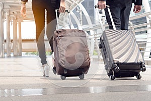 Business people carrying suitcase journey to business trip with colleague