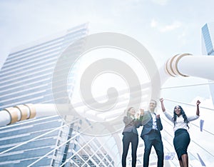 Business people celebrating by throwing papers in the air in city