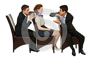 Business people on chairs having conversation