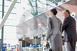 Business people checking their bags in airport