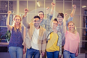 Business people cheering at the camera