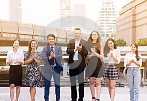 Business people clap hands after finishing up a meeting outdoor,Successful diversity group of business people,Teams success achiev