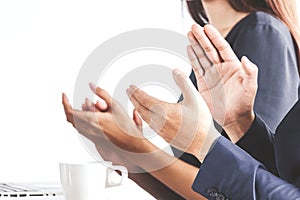 Business people clapping hands in the meeting